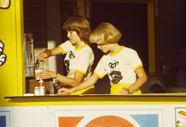 Girls working at concession stand, 1977